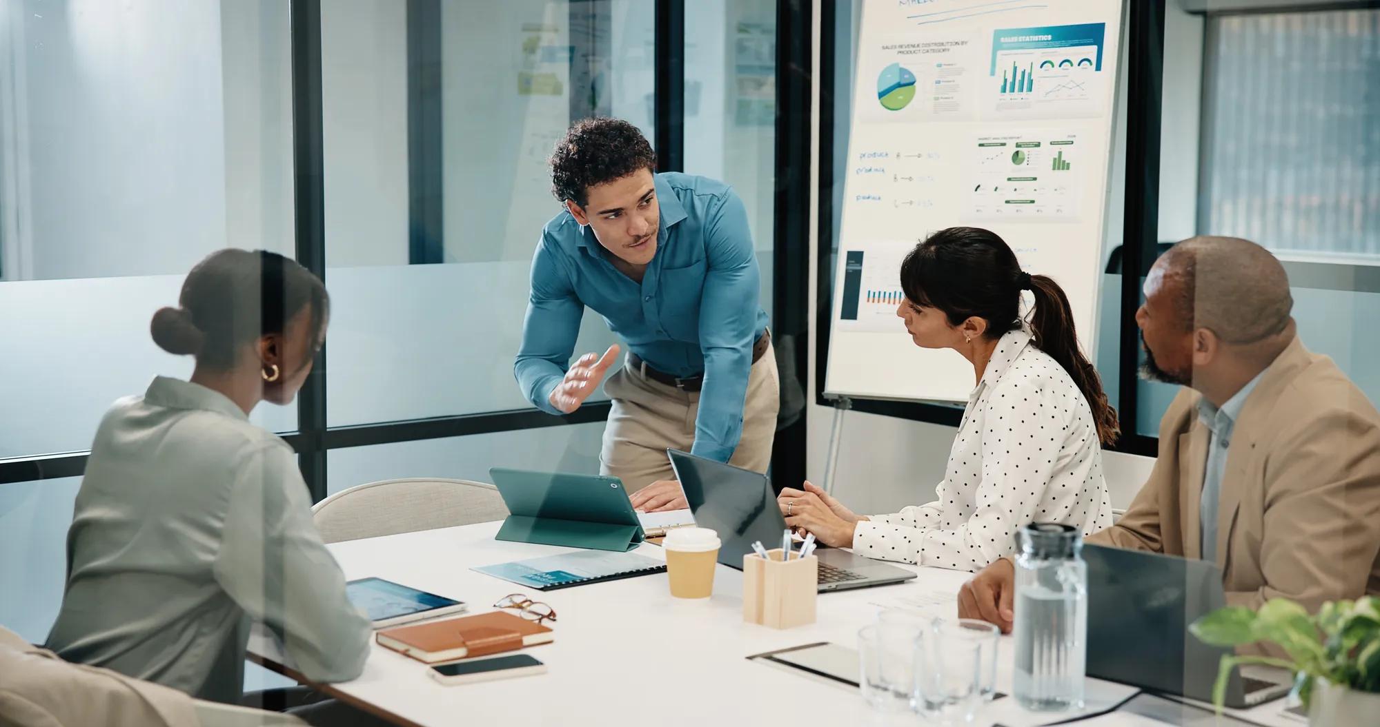 Meeting, tablet and people with presentation for data analytics, proposal or explain strategy. Leadership, presenter or analyst with team discussion for insights, stats or review of digital growth.