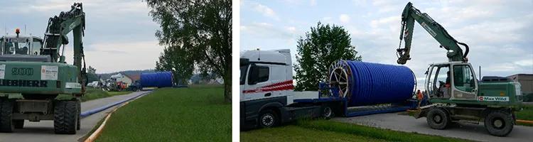 TS Rohr wird für die Verlgung vorbereitet und entlang der Straße von der Trommel abgerollt.