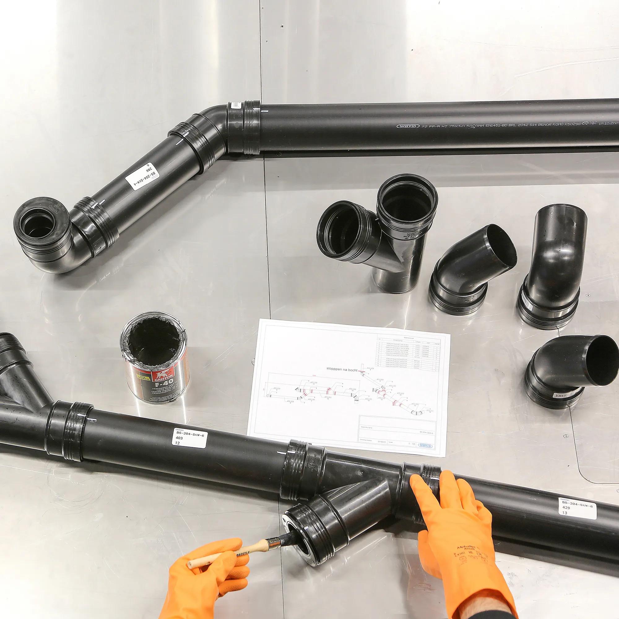 PP sewer pipes being fitted together in the Prefab Department Netherlands