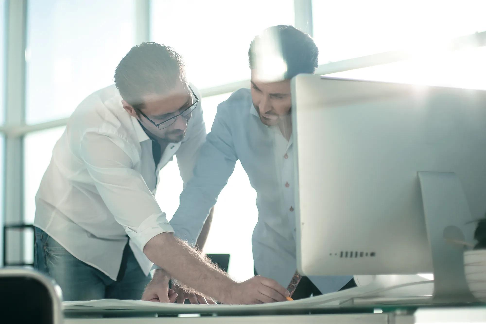 background image. engineer and architect look at the sketches of the project