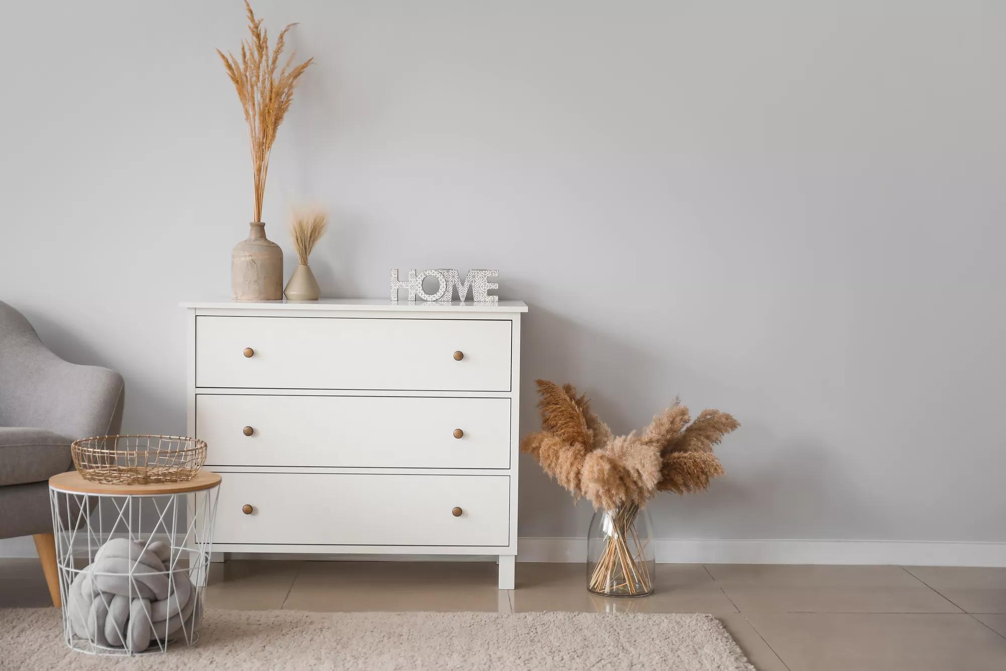 Interior of beautiful stylish room with chest of drawers
