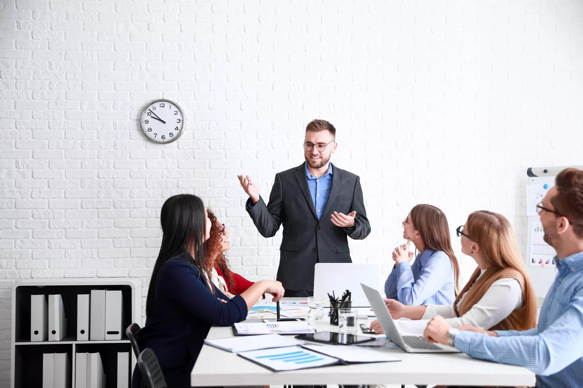 Colleagues discussing issue at business meeting in office